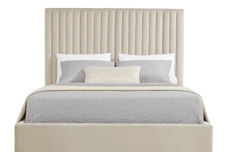 beige bed with high backboard and gray sheets