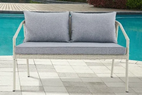 white wicker sawtucket bench with blue/gray cushions