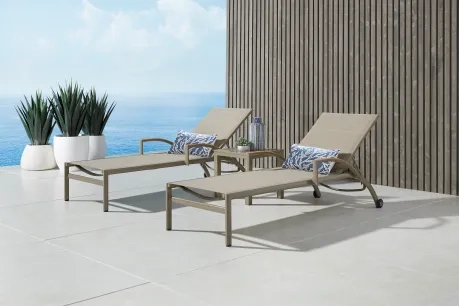 two taupe outdoor chaises with an ocean view