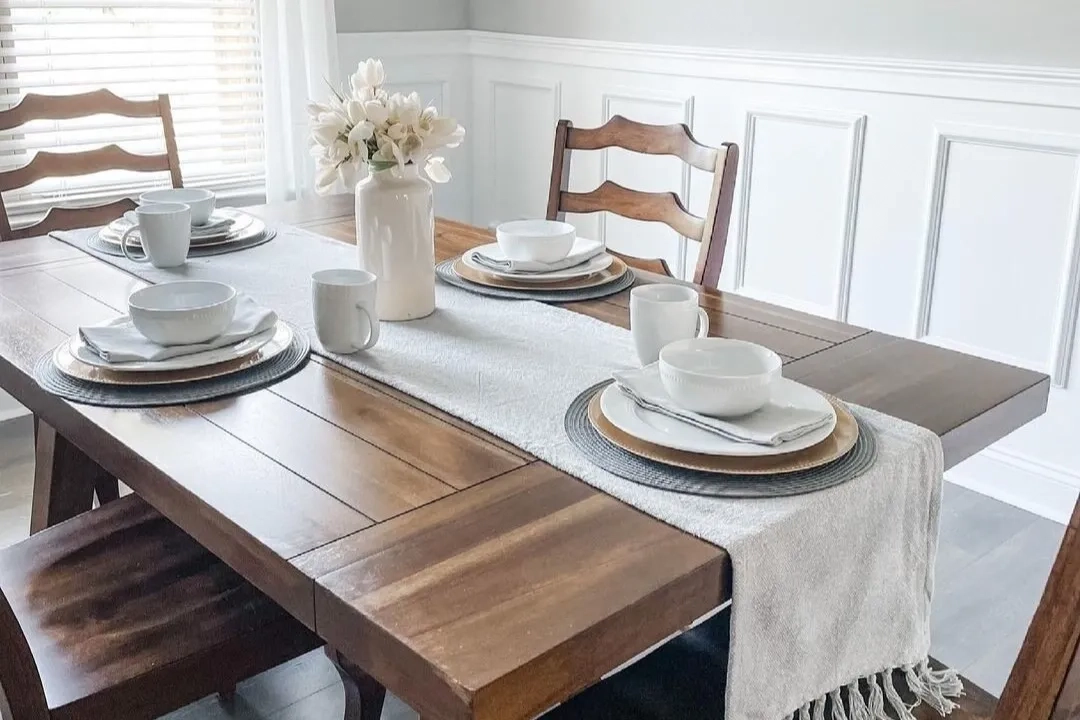 Farmhouse style dining room table accented with earth tones