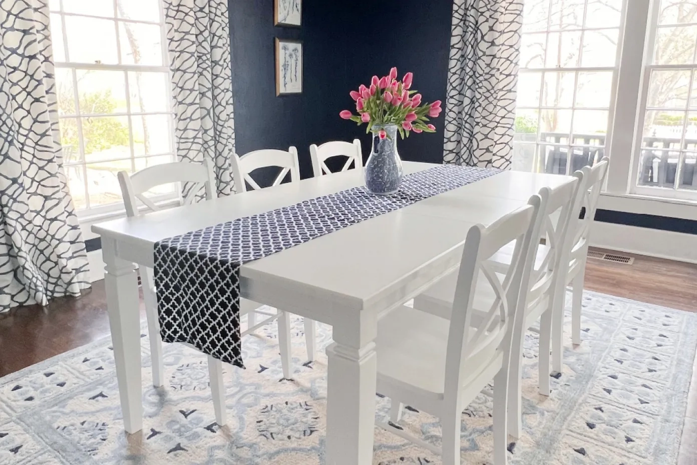 white dining room table with flowers