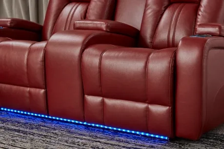 theater seating in red with lights under it