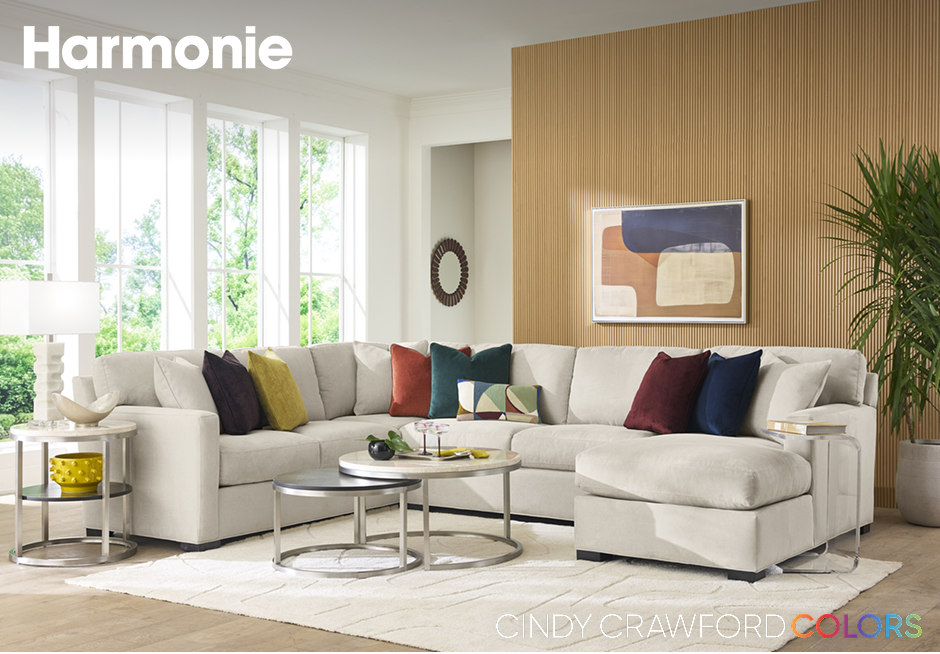 Harmonie. A sectional sofa with colorful pillows.
