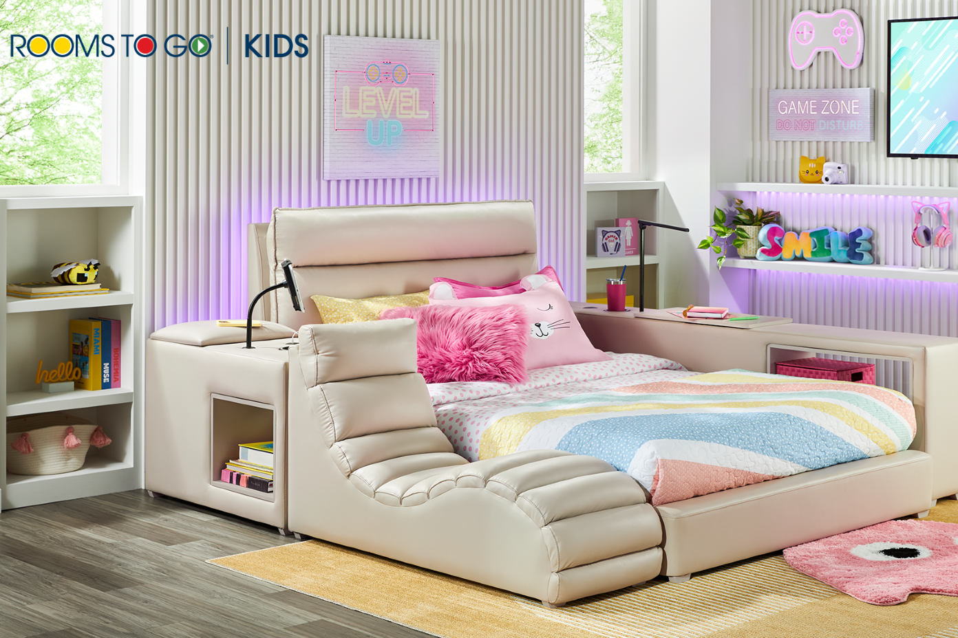 Rooms to Go Kids gaming bed with "Level Up" sign and "Game Zone" sign.