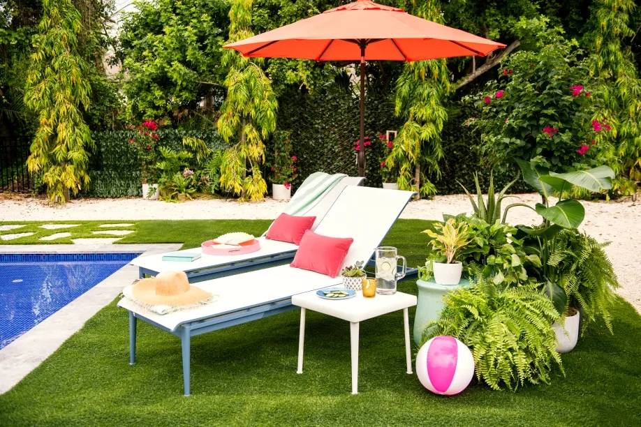 pool chair with red patio umbrella 