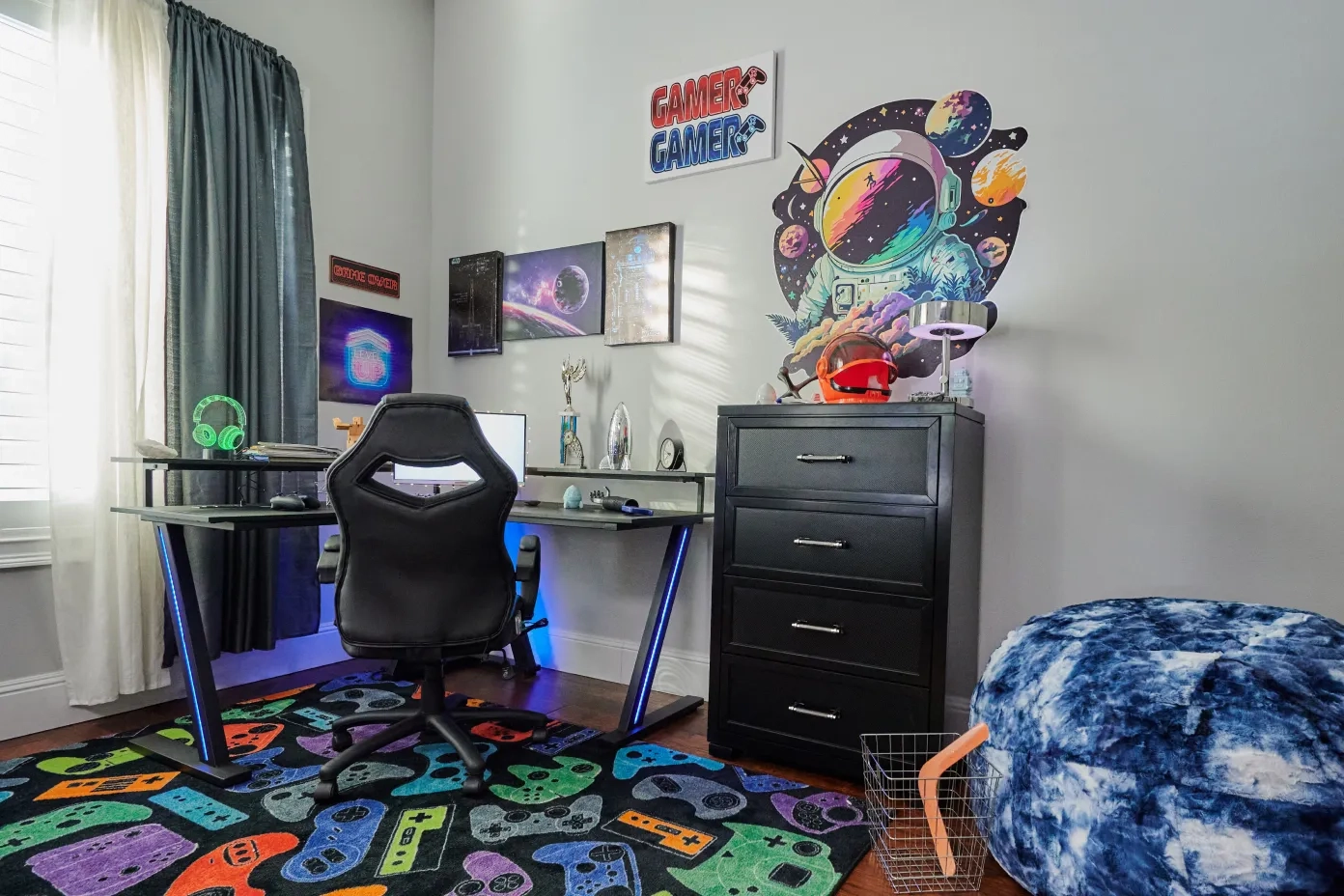 desk in a gaming room with a chair