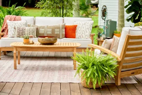 brown outdoor couch with white cushions