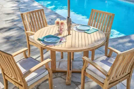 patio dining set by a pool 