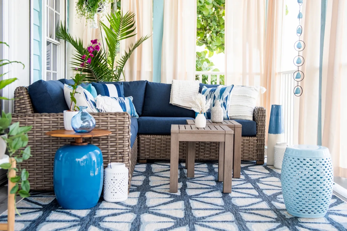 tan outdoor sectional with blue cushions