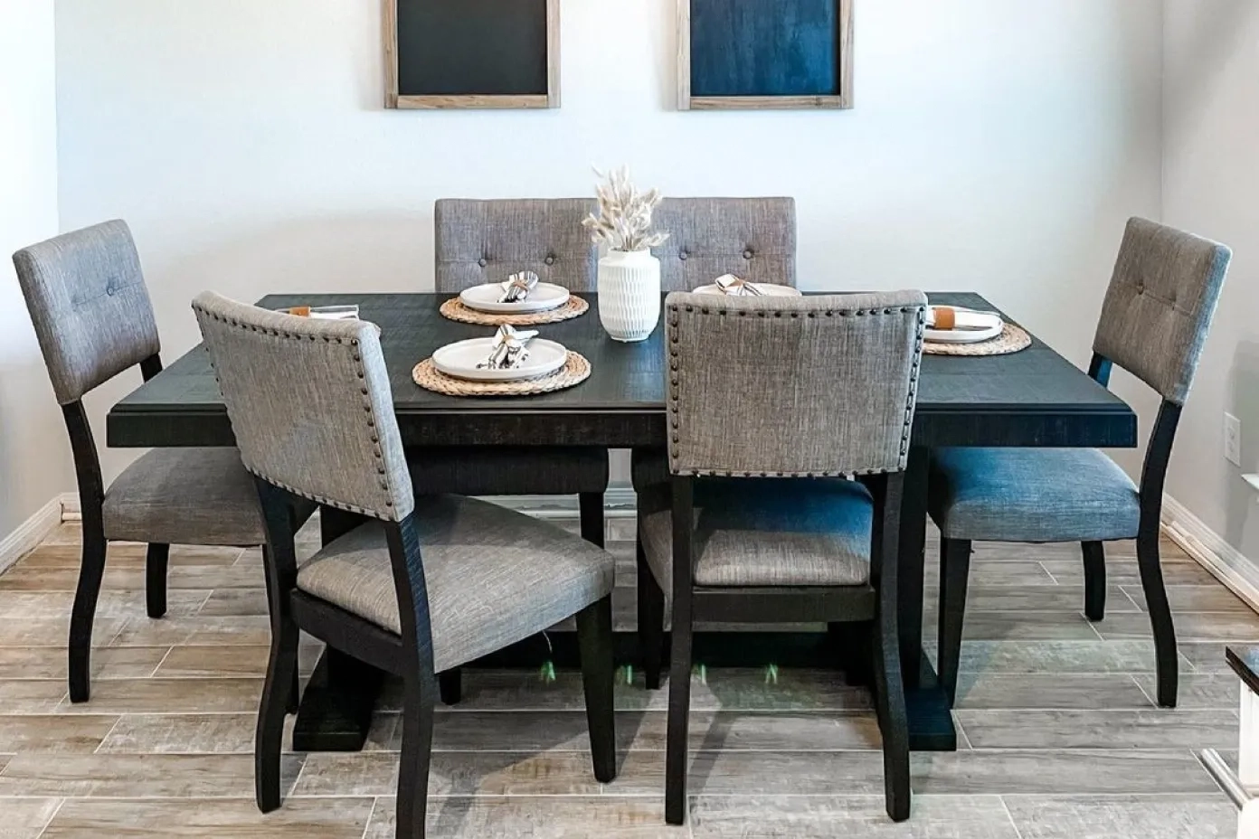 black dining room table and gray chairs
