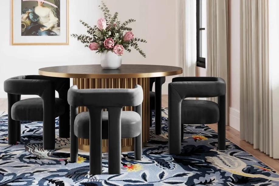 gold dining room table with black velvet chairs