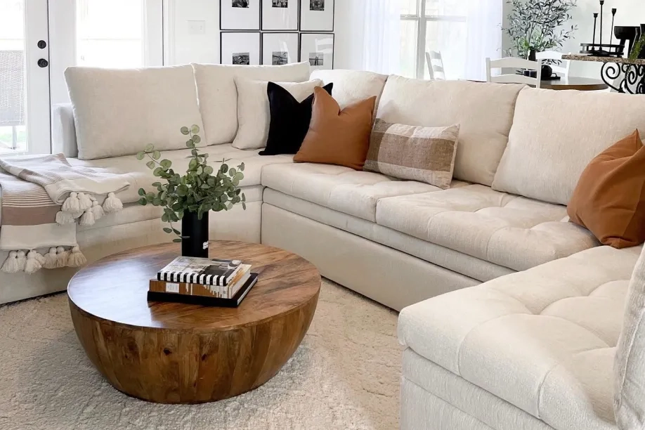white couch with wood accent coffee table 