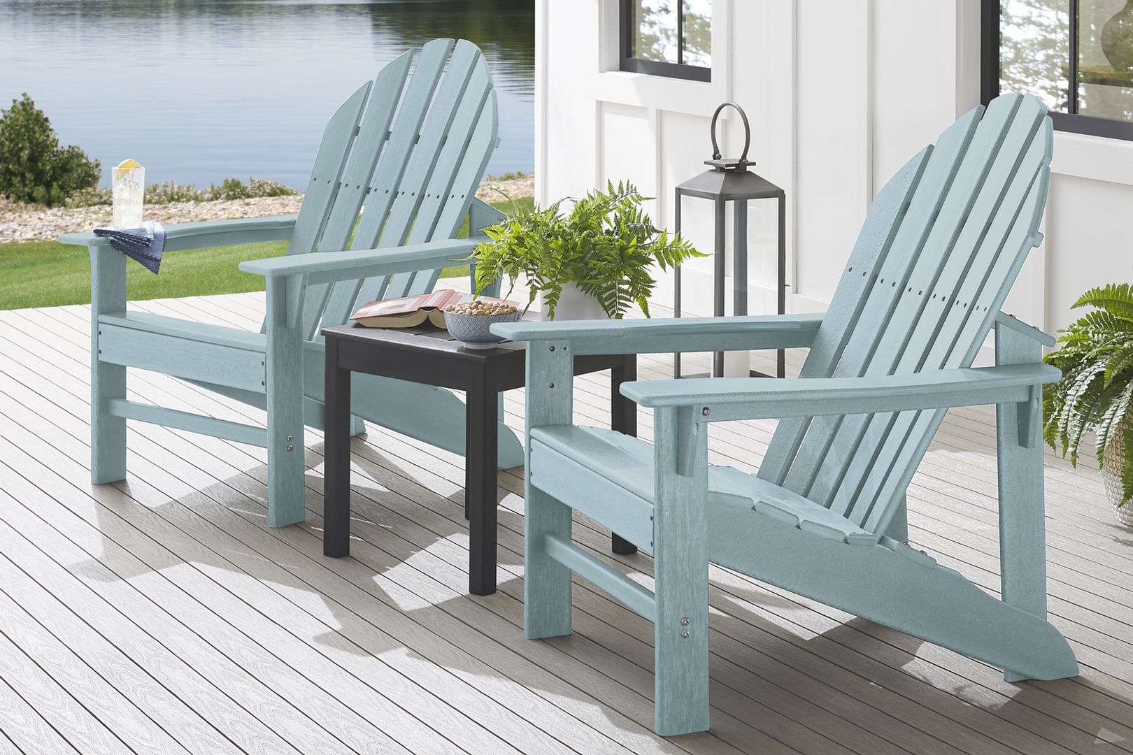 photo of set of two blue wooden Adirondack chairs