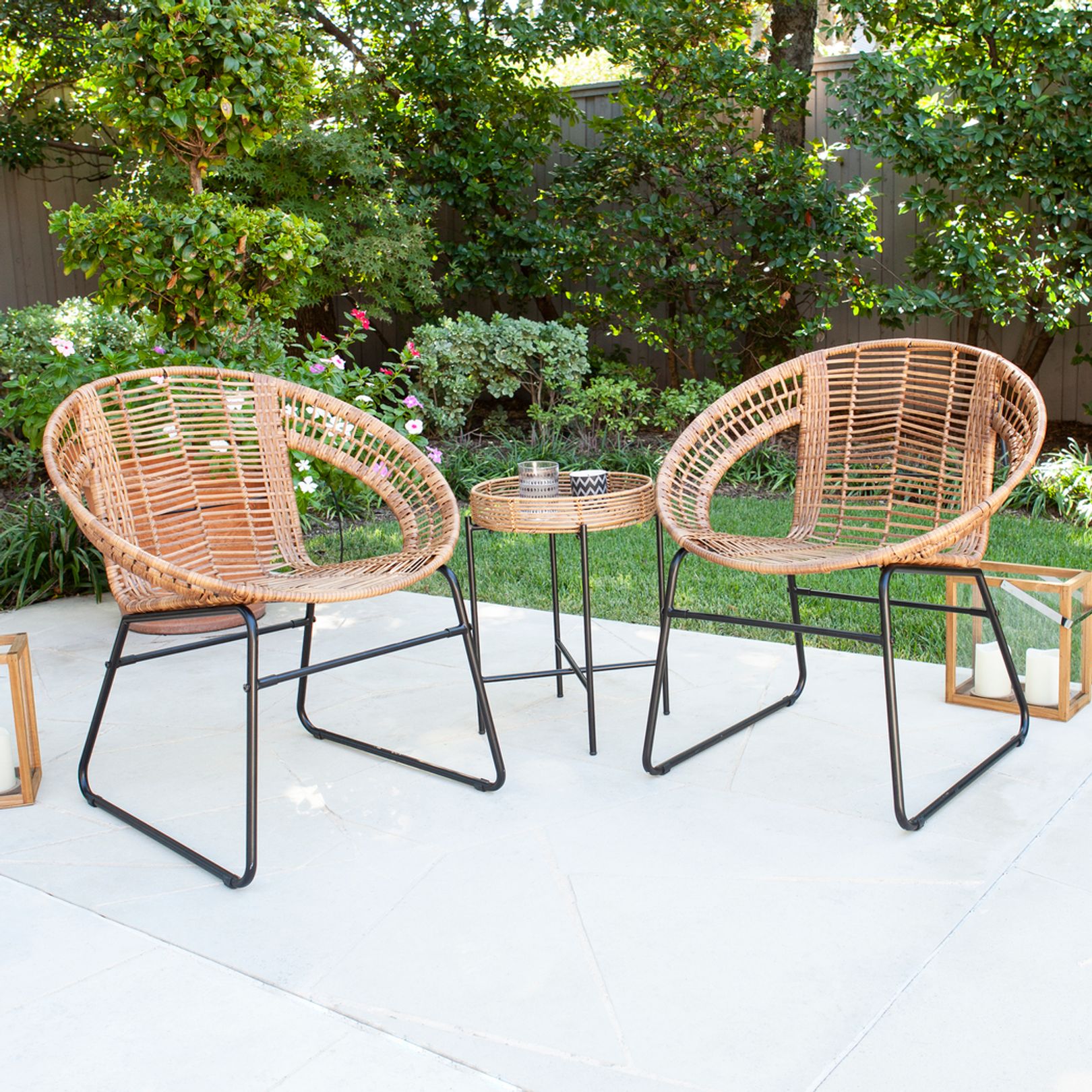 Photo of two rattan patio chairs and a table