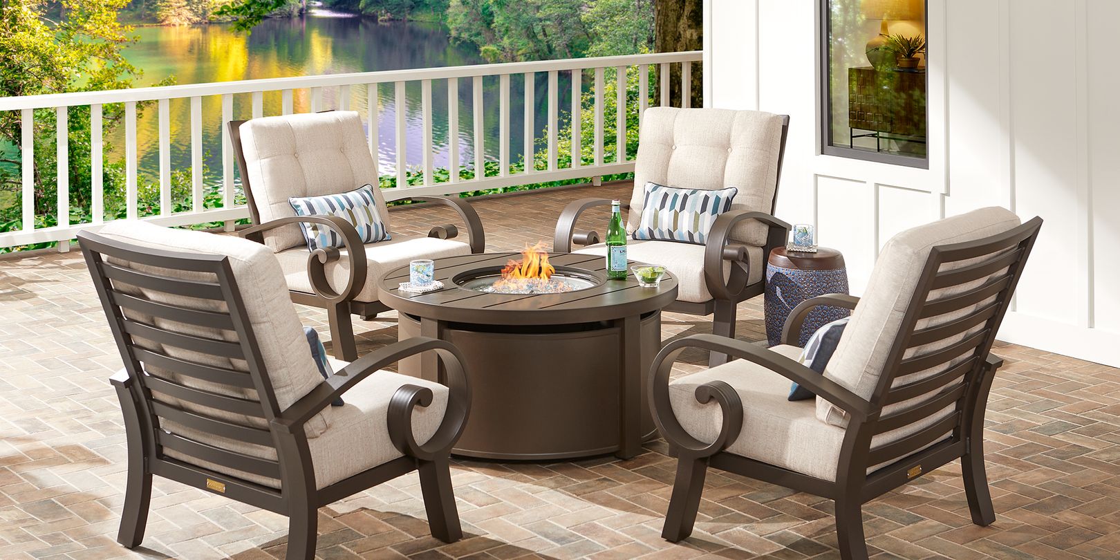 Photo of bronze metal patio seating set arranged around a fire pit