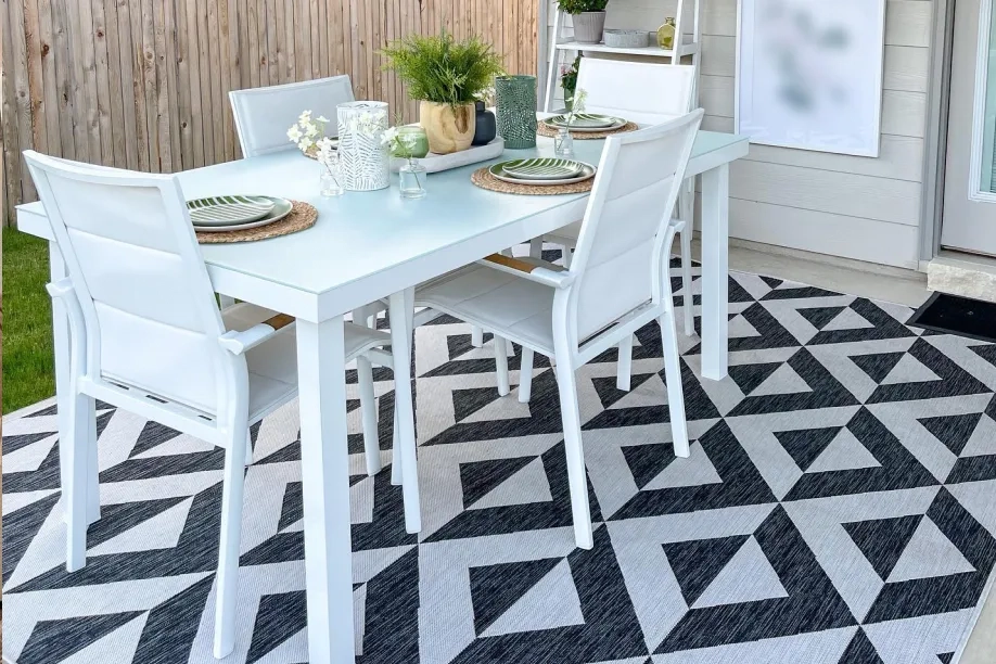 black and white rug with white table 