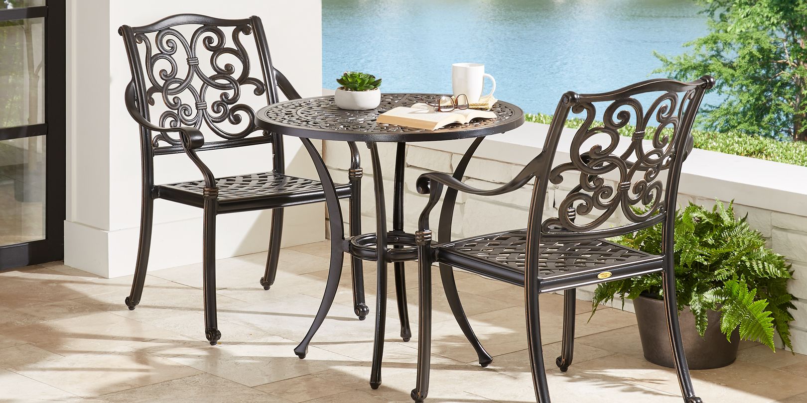 Photo of a 3-piece wrought iron bistro set on a patio