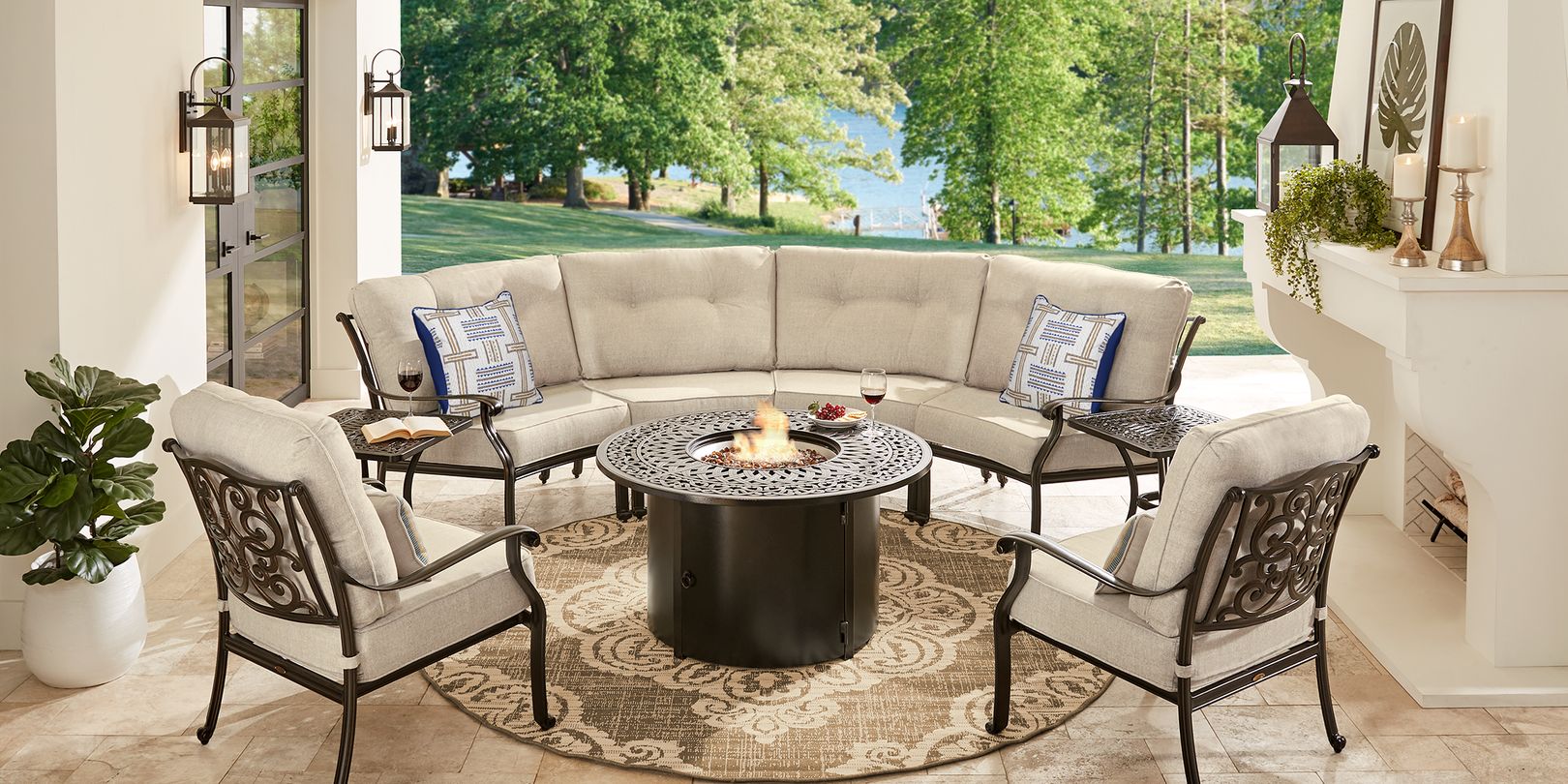 Photo of patio seating set with curved sectional, a fire pit and chairs