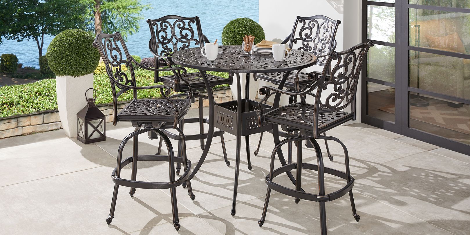 Photo of a 5-piece cast aluminum bar height dining set