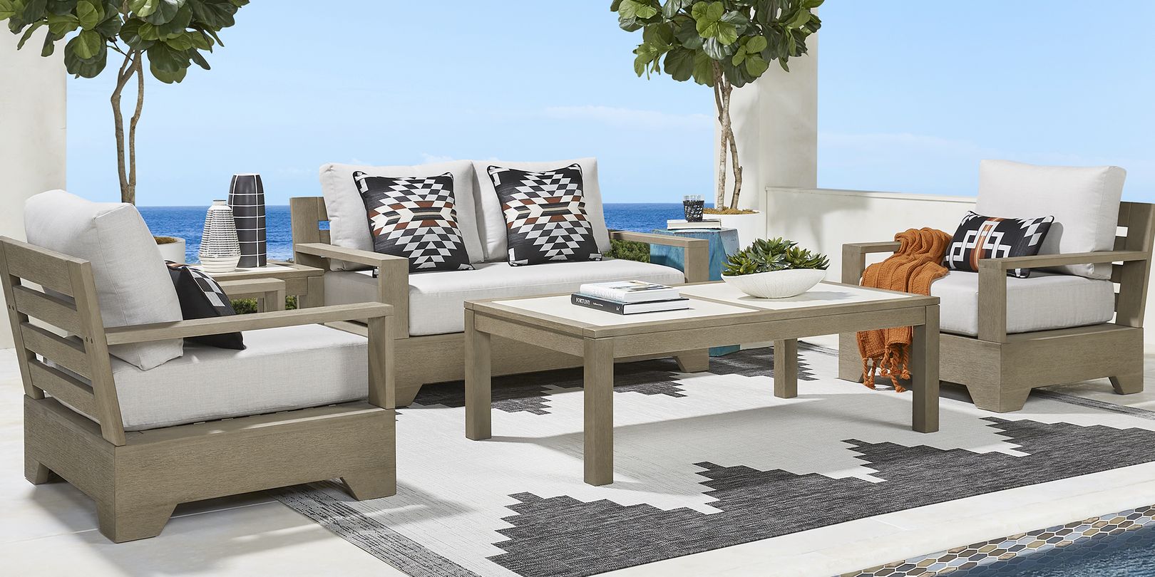 Photo of eucalyptus patio seating set with ivory cushions