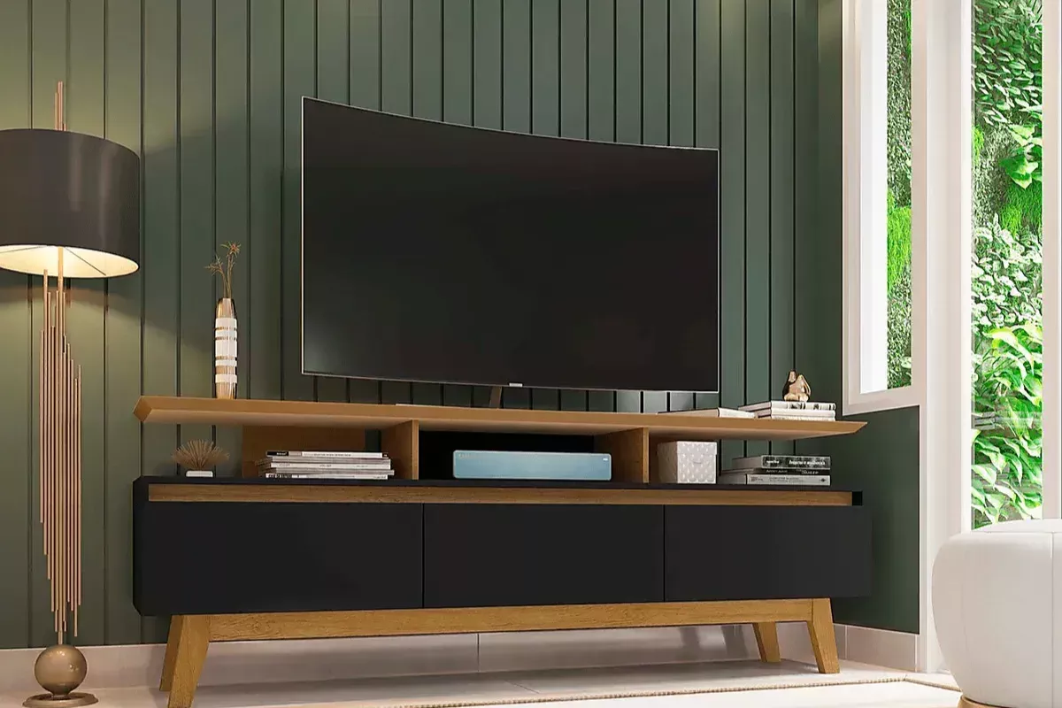 TV stand against green accent wall