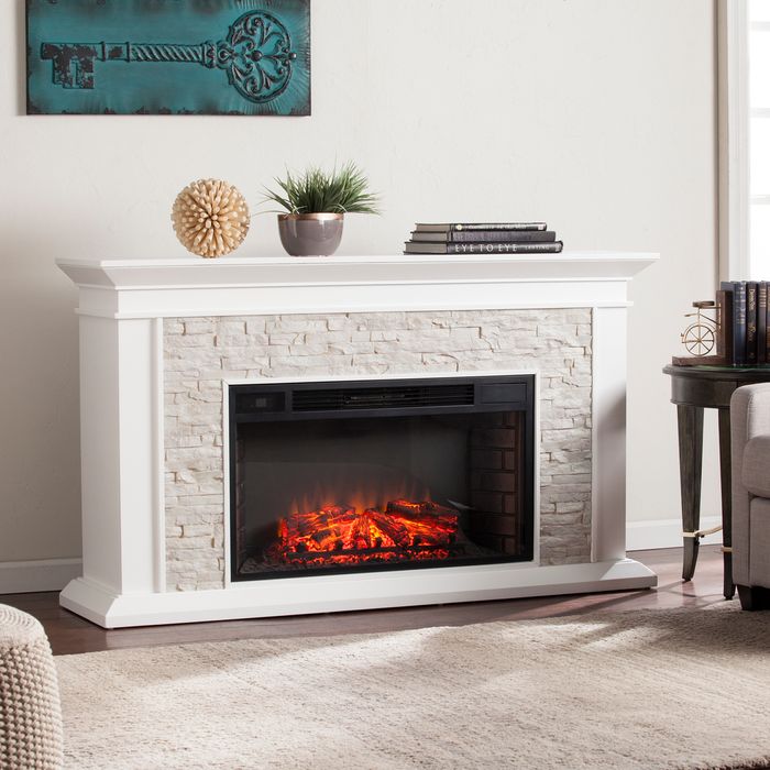 white fireplace with decor on top
