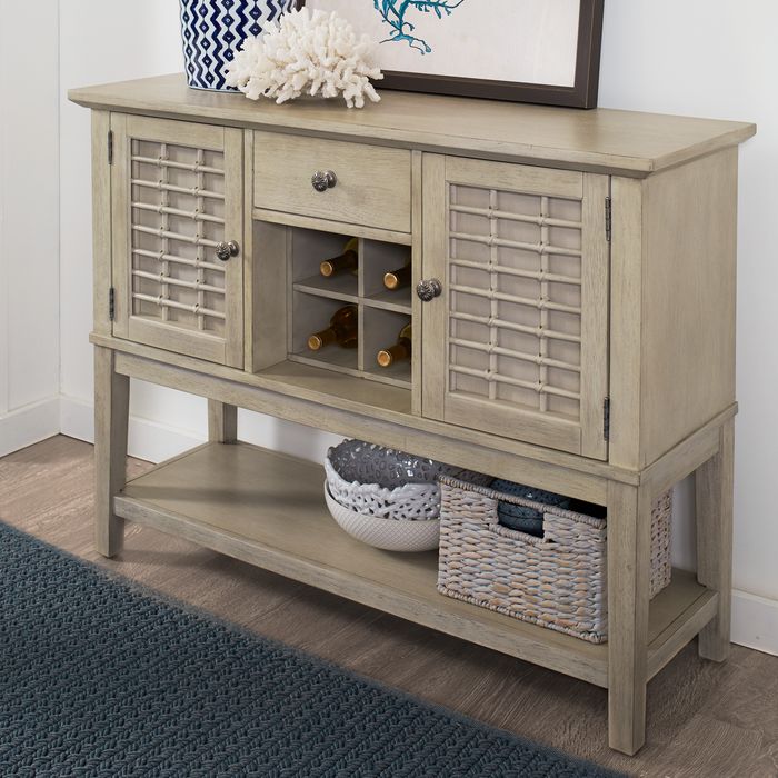 gray sideboard holding wine bottles and glasses