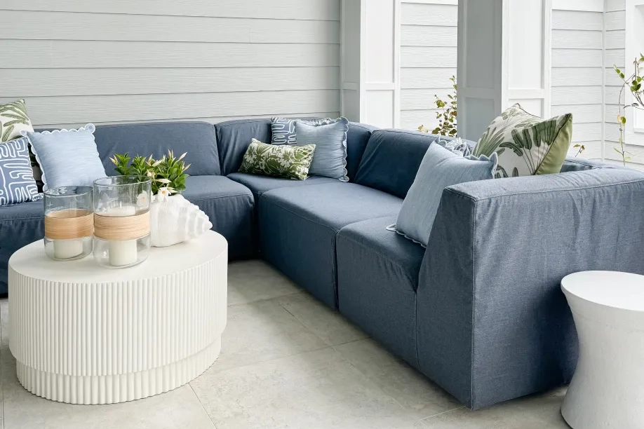 blue couch with white coffee table 