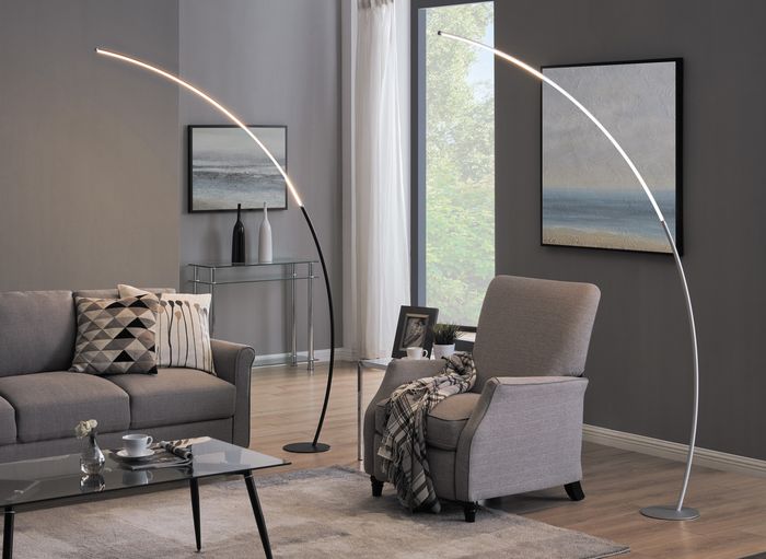 a black and a silver floor lamps in living room