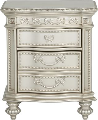 A white seashell lamp sits on a shared white lacquer nightstand positioned between tan french headboards in an elegant girls' bedroom. girls kids nightstands bedside tables