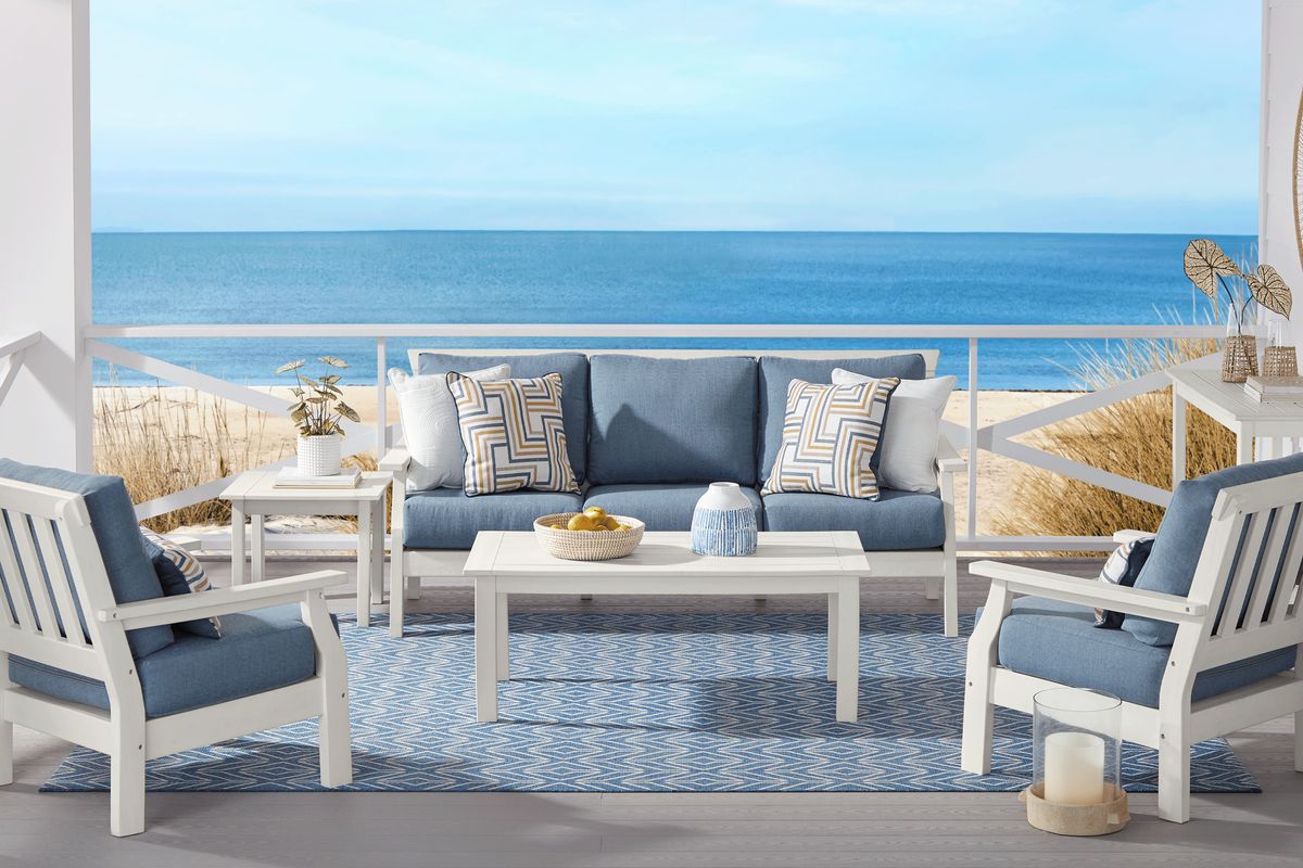 White patio furniture shop with blue cushions