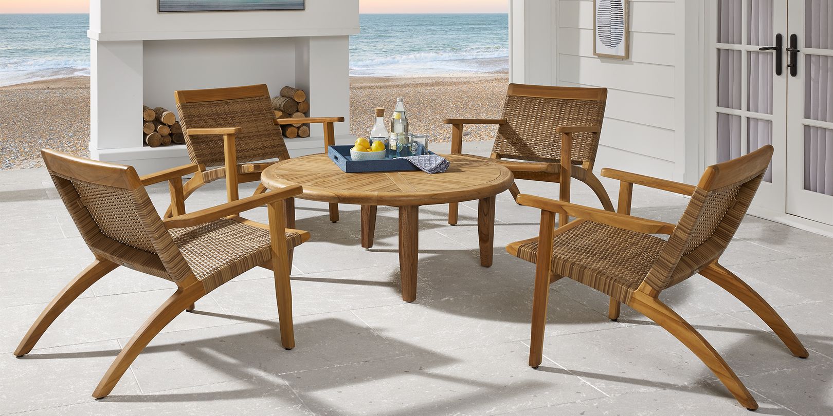 Photo of outdoor wooden seating set with wicker seats and table