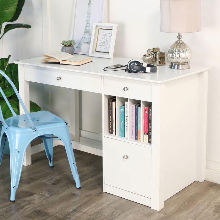 white desk with neutral colored desk accessories