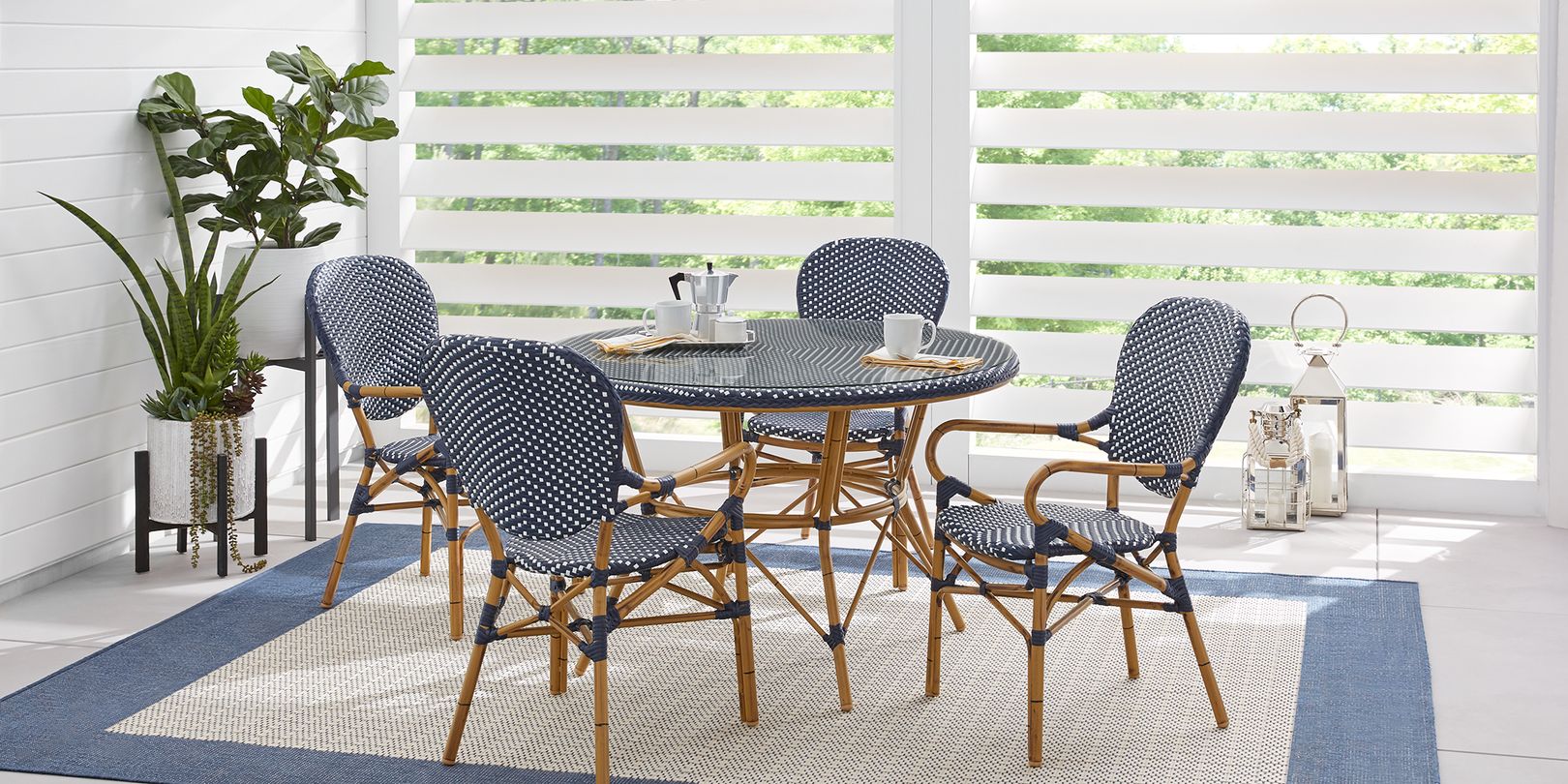 Photo of blue and tan wicker outdoor dining set