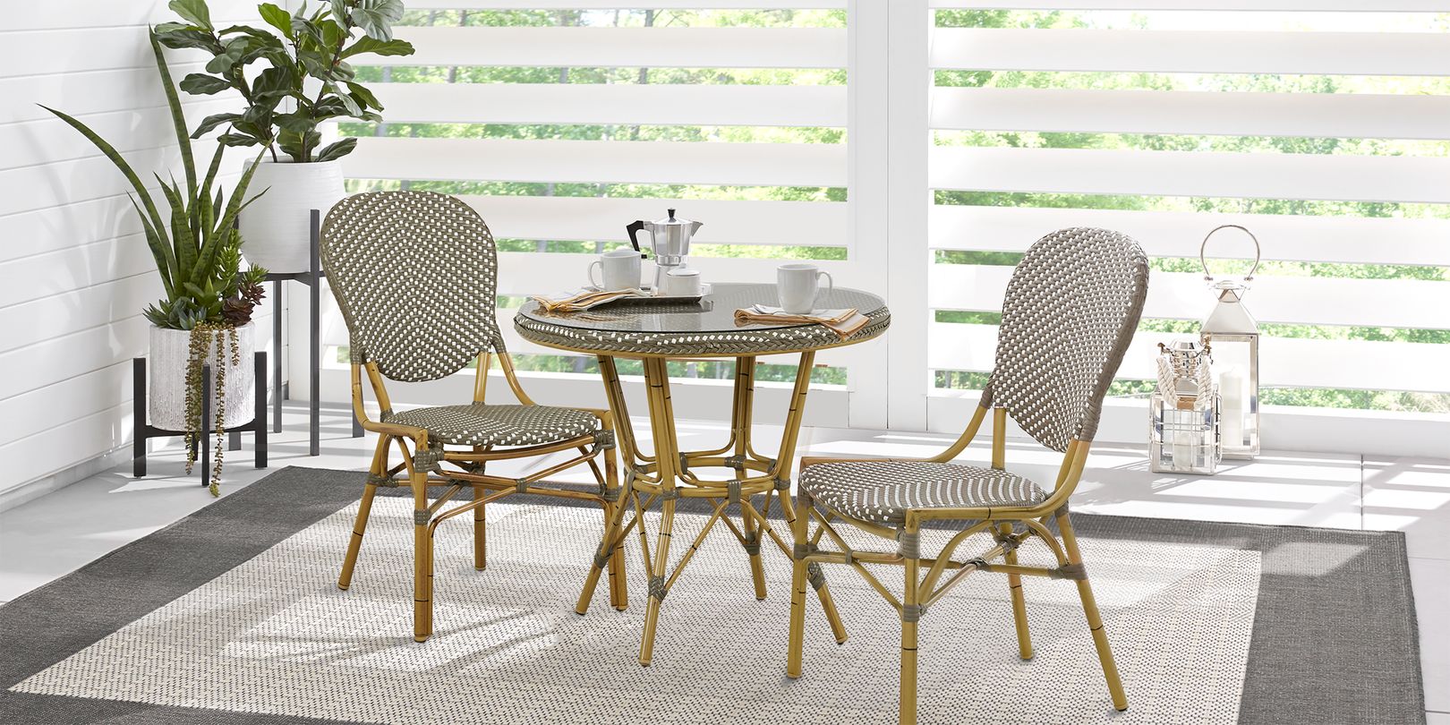 Photo of wicker bistro set in enclosed sunroom