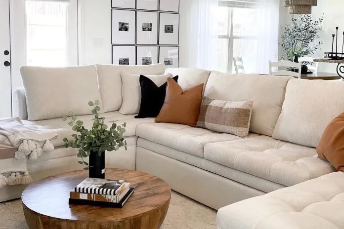 Beige sectional sofa with neutral pillows