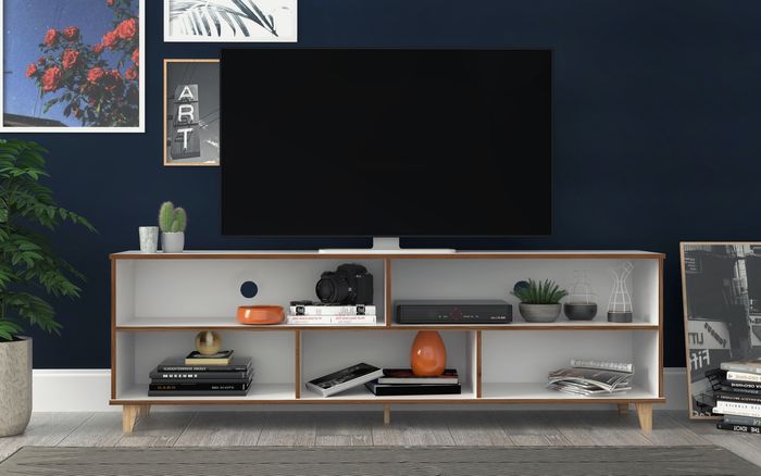 tv console with art hanging behind