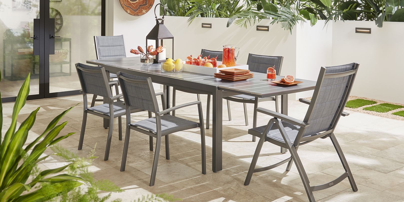 photo of a gray metal extension table and chairs