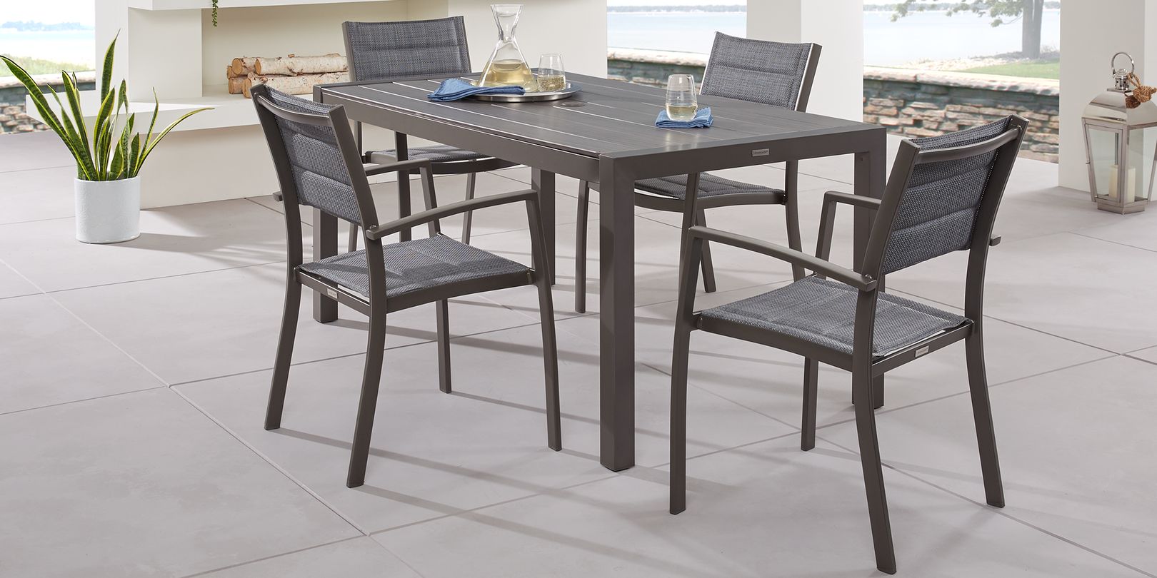 Photo of brown metal 5-piece outdoor dining set