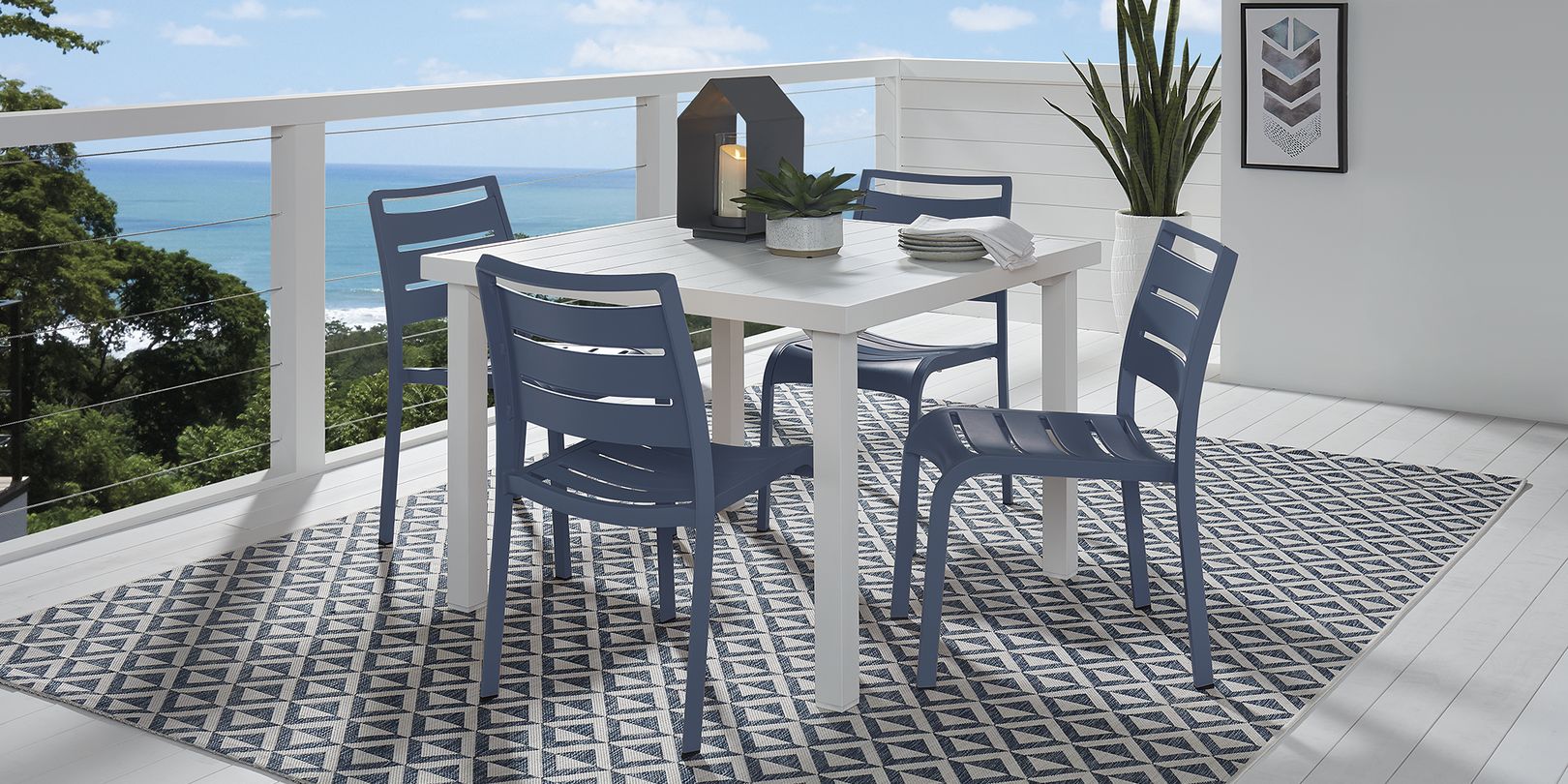 photo of white aluminum patio dining set with blue chairs