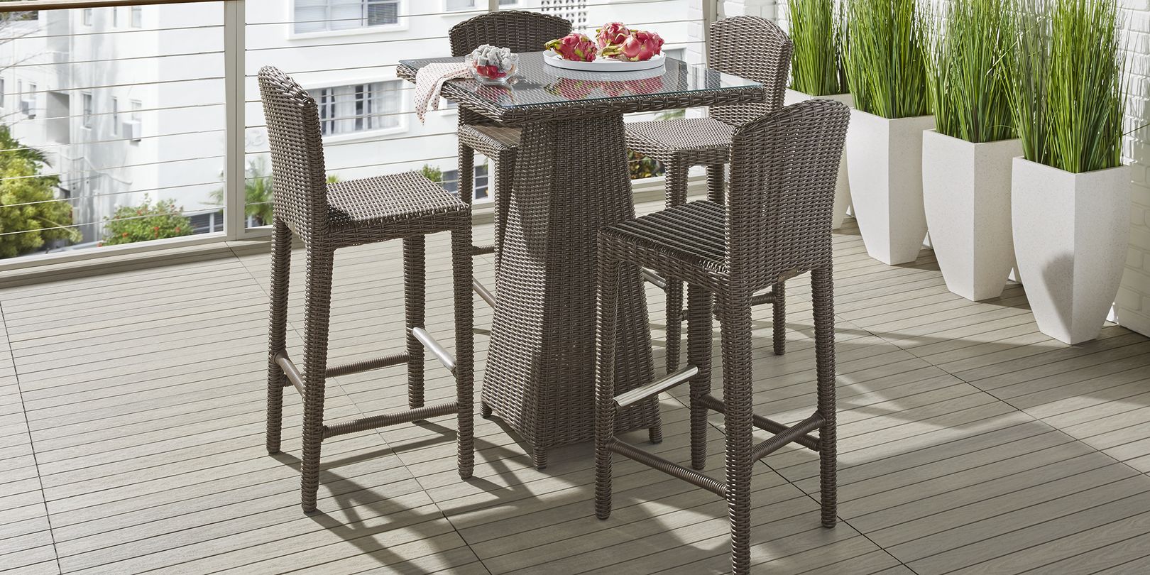 photo of brown wicker bar height dining set