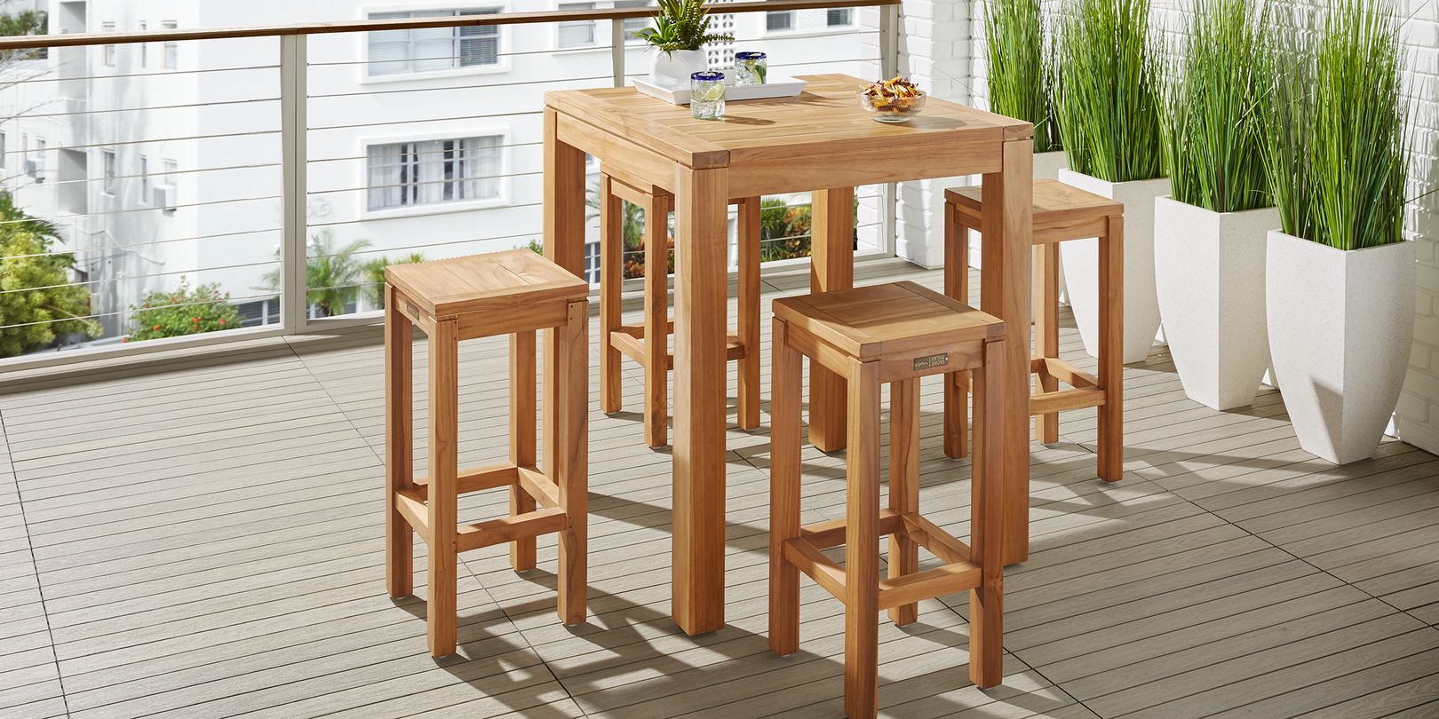 Photo of wooden bar height patio dining set