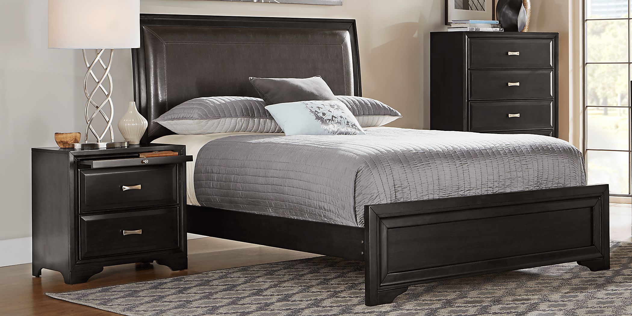 https://assets.roomstogo.com/product/belcourt-black-5-pc-king-upholstered-sleigh-bedroom_8315544P_image-room?cache-id=c749d2ad8a880515d9d7331ea7cf39af