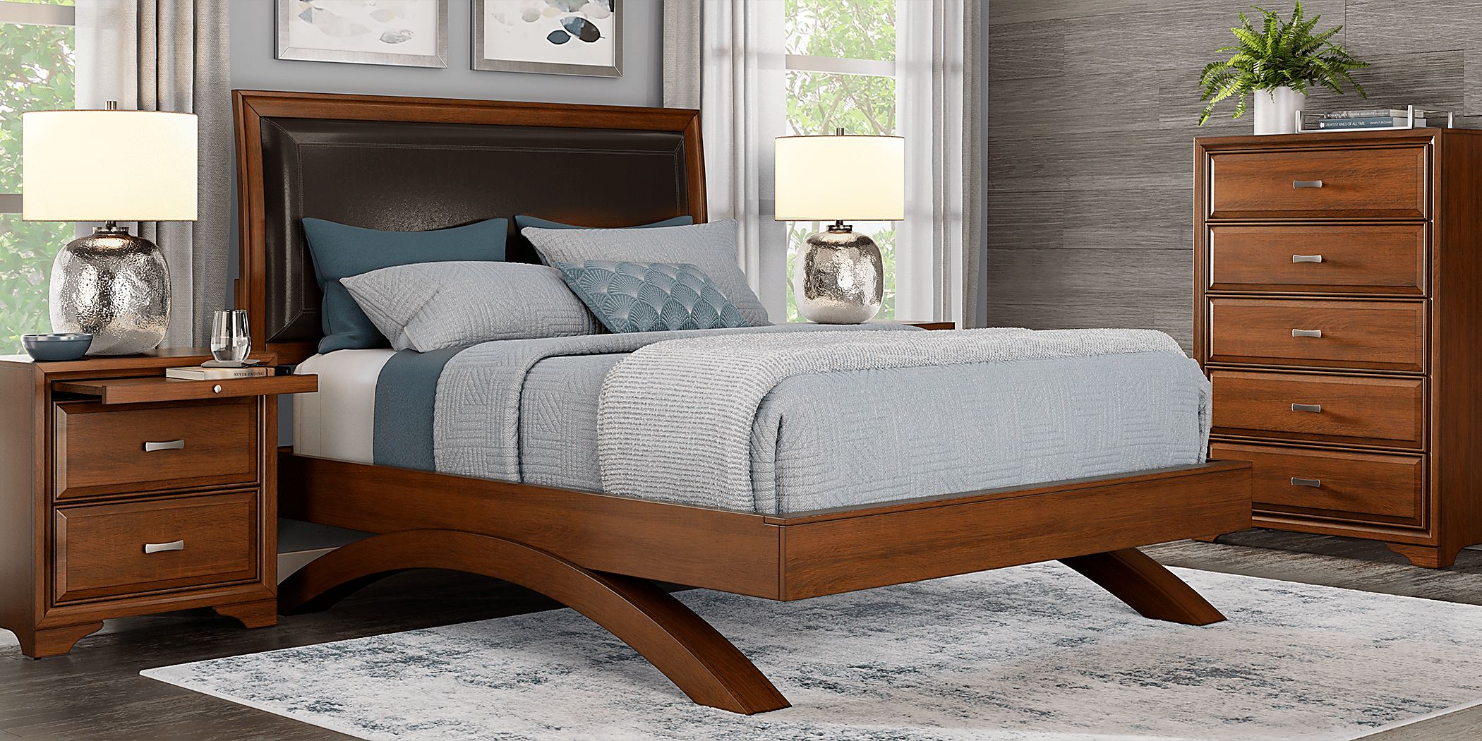 https://assets.roomstogo.com/product/belcourt-brown-cherry-5-pc-king-upholstered-sleigh-arch-bedroom_8315540P_image-room?cache-id=1fb4e7925da8bcfc079d8a076fc2ad90