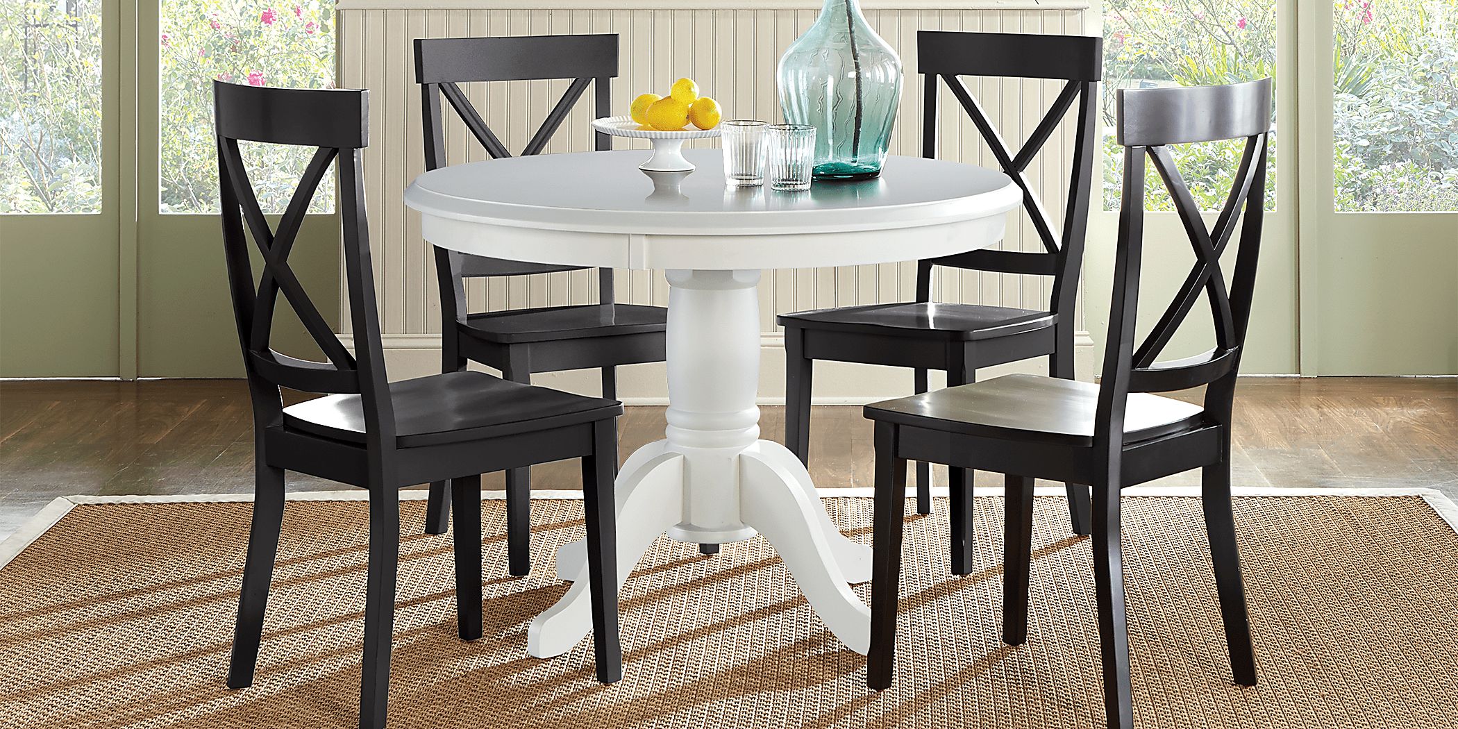 Brynwood White 5 Pc Round Dining Set with Black Chairs - Rooms To Go