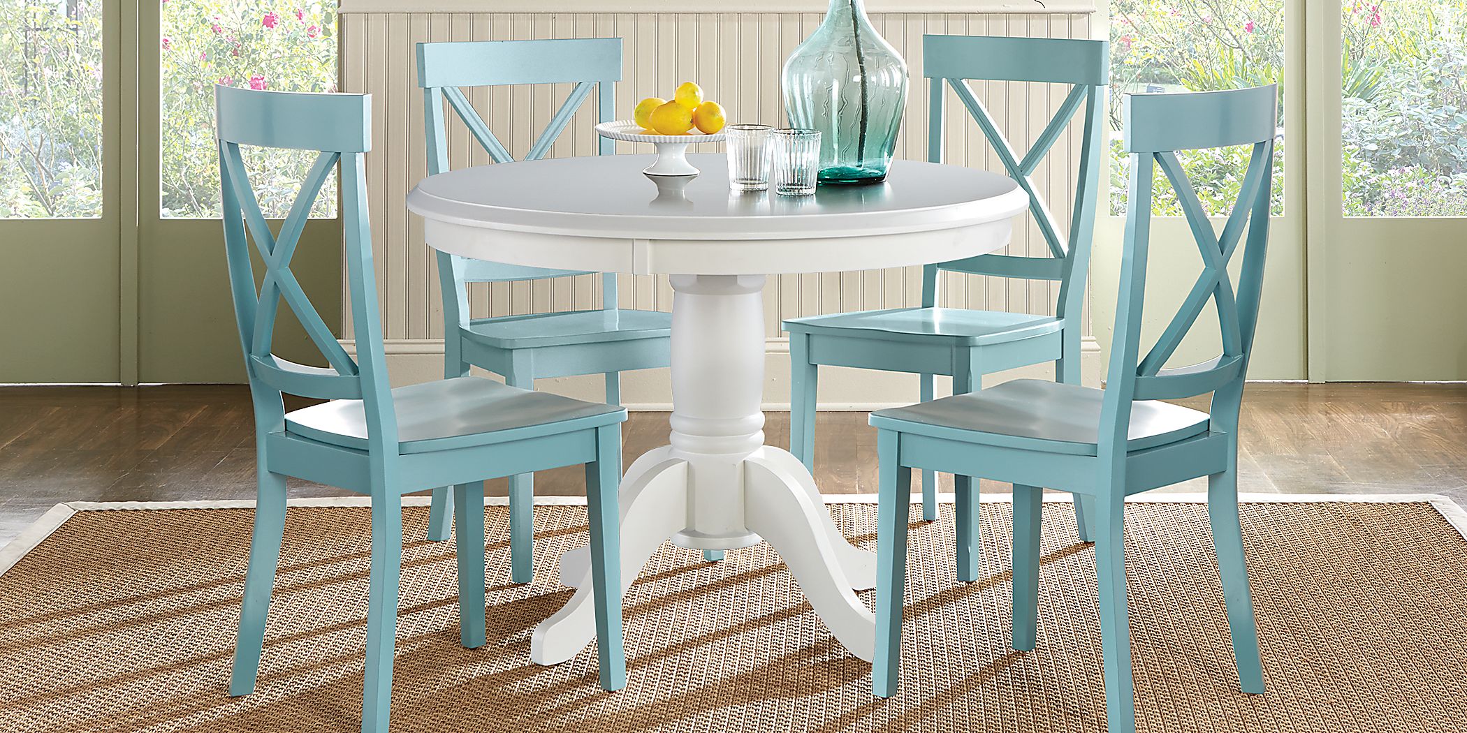 White dining table with blue 2024 chairs