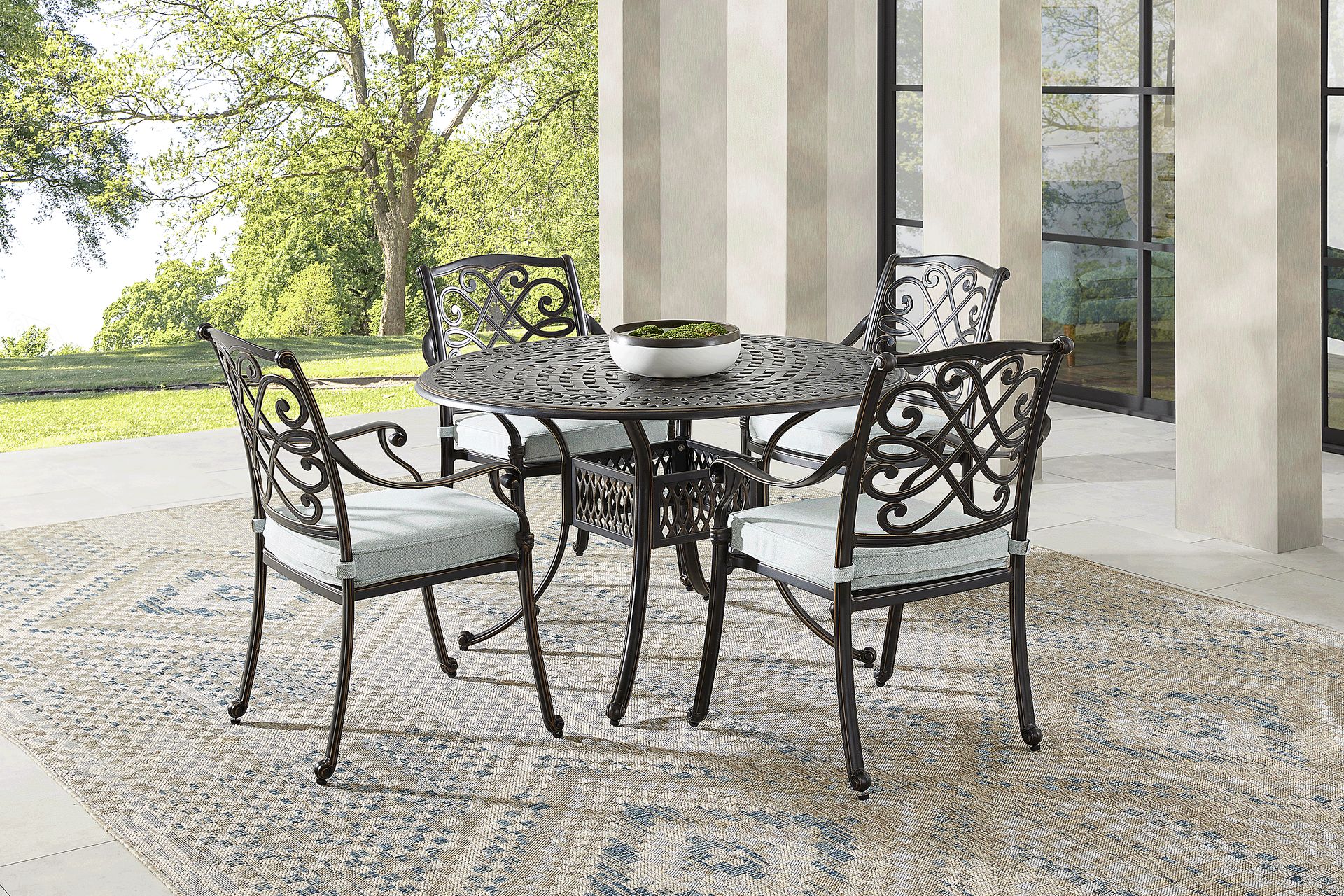 Carina Bronze 5 Pc 48 in. Round Outdoor Dining Set with Sky Cushions - Image 1