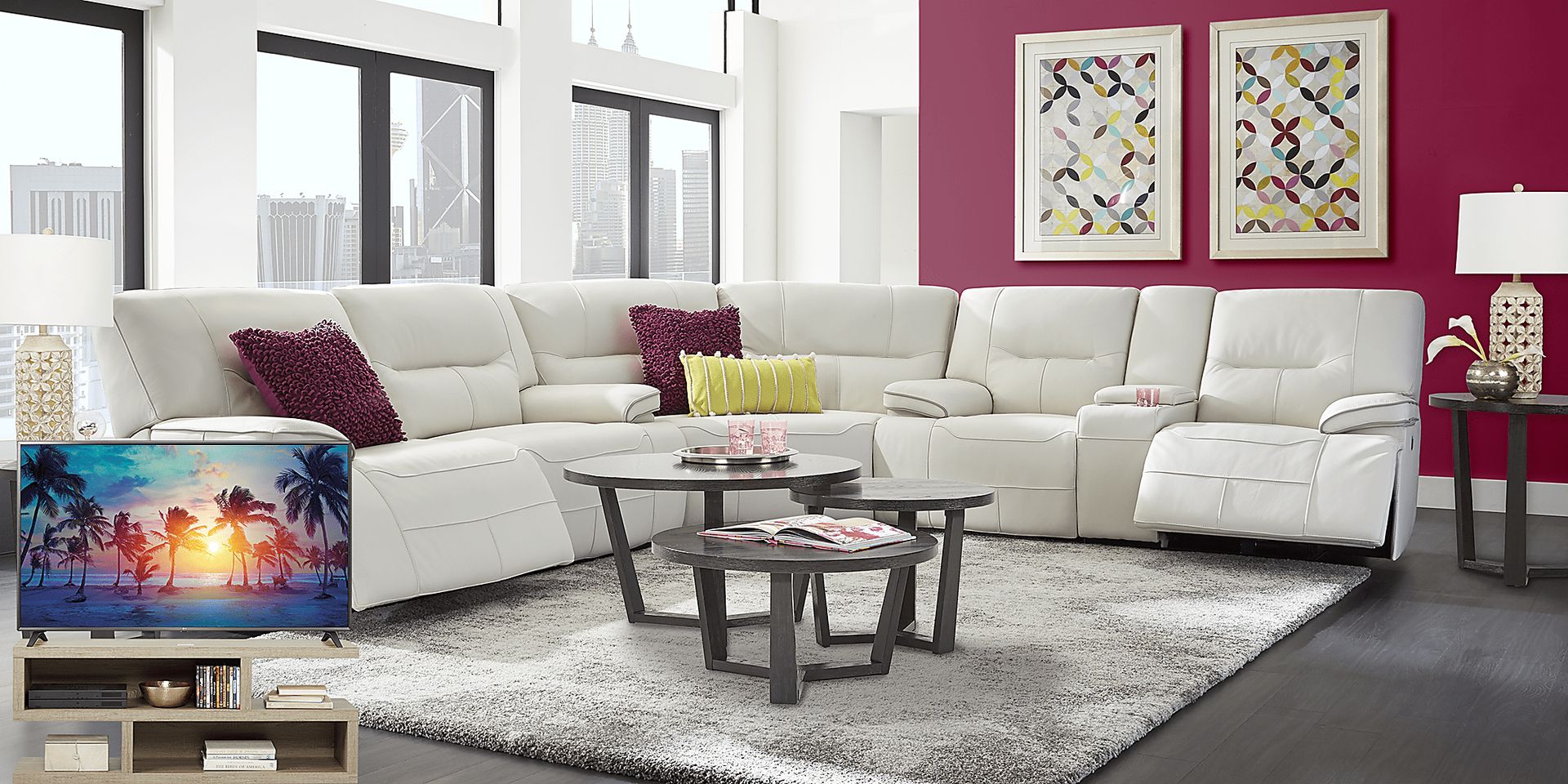 Cindy Crawford Home Caletta Off-White 7 Pc Leather Reclining Sectional Living Room Plus 70 in. TV - Image 1