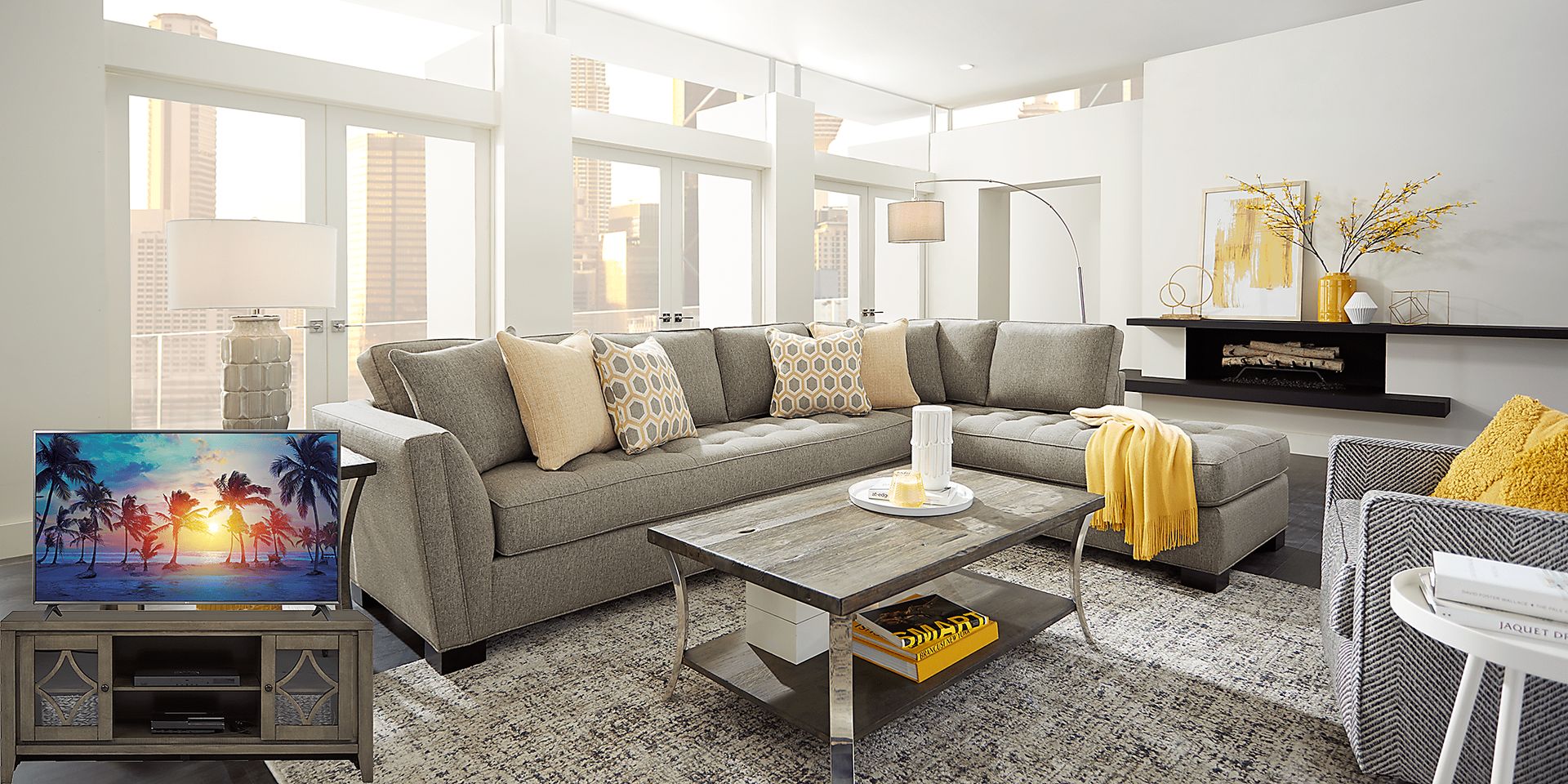 Cindy Crawford Home Calvin Heights Cobblestone 6 Pc XL Sectional Living Room Plus 70 in. TV - Image 1