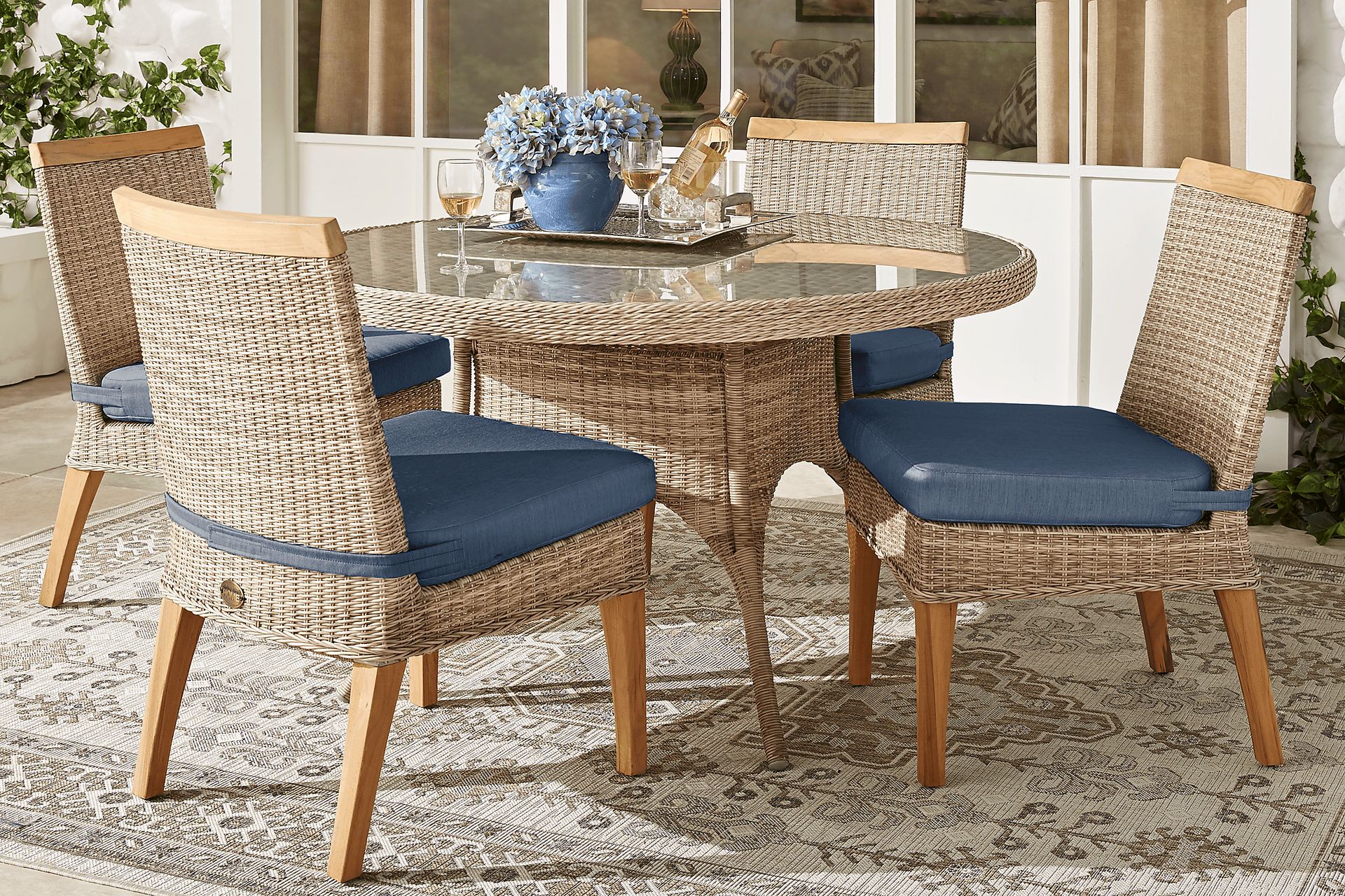 Cindy Crawford Home Hamptons Cove Gray 5 Pc Round Outdoor Dining Set with Denim Cushions - Image 1